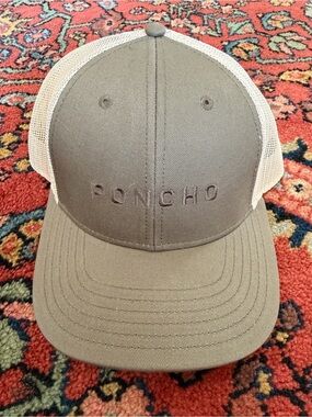 Poncho Outdoors Trucker Hat interior with mesh and label